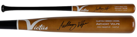 Two brown wooden baseball bats by Sports Integrity, both signed and custom-designed for Anthony Volpe. These Victus Game Model Pro Reserve maple bats are labeled "Anthony Volpe New York Yankees" and certified by Fanatics.