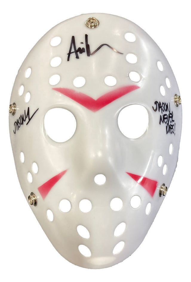 The Ari Lehman Signed Jason Voorhees White Costume Mask by Sports Integrity features red markings, multiple ventilation holes, metal rivets, black signatures, and "JASON NEVER DIES!" written on it.