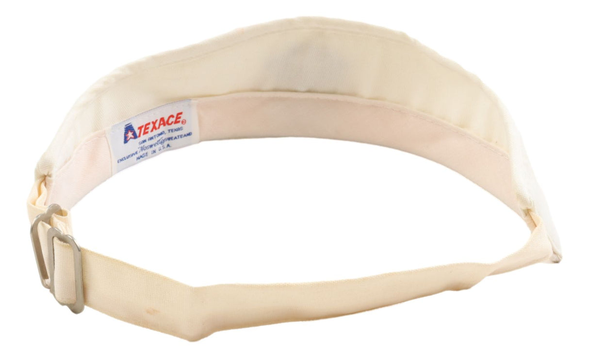 A Sports Integrity Arnold Palmer Signed 1992 PGA US Senior Open visor, featuring an adjustable beige fabric band with a metal buckle and inner Atexace label.