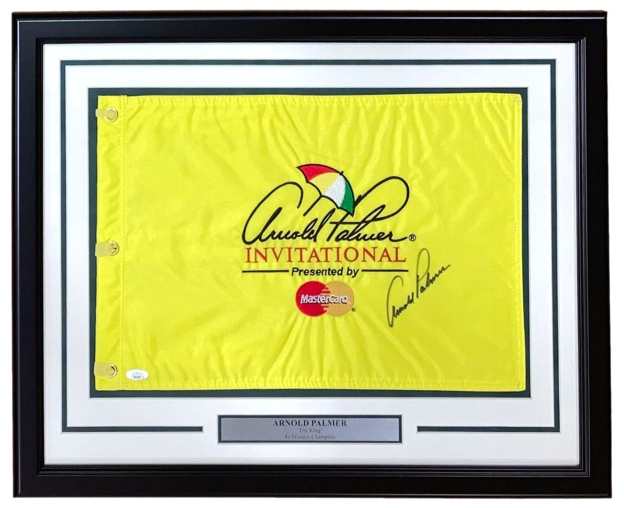 The Sports Integrity Arnold Palmer Signed Framed Arnold Palmer Invitational Yellow Golf Flag features the tournament and MasterCard logos, a signature, JSA LOA authentication, and a silver plaque inscribed "Arnold Palmer, Professional Golfer.