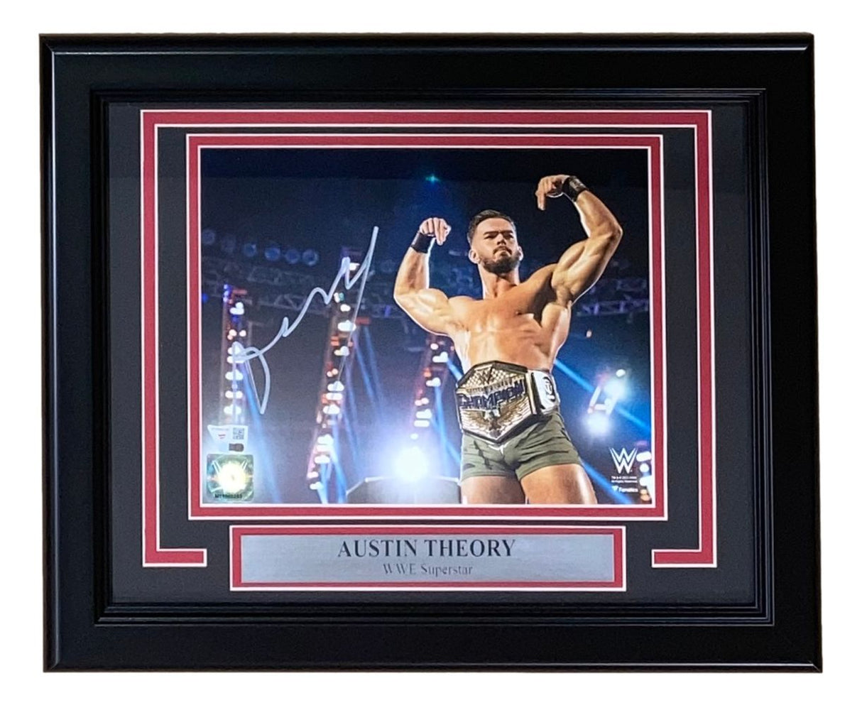 The Sports Integrity Austin Theory Signed Framed 8x10 WWE Photo by Fanatics features the WWE Superstar posing with a championship belt, complete with autograph and labeled beneath the image.