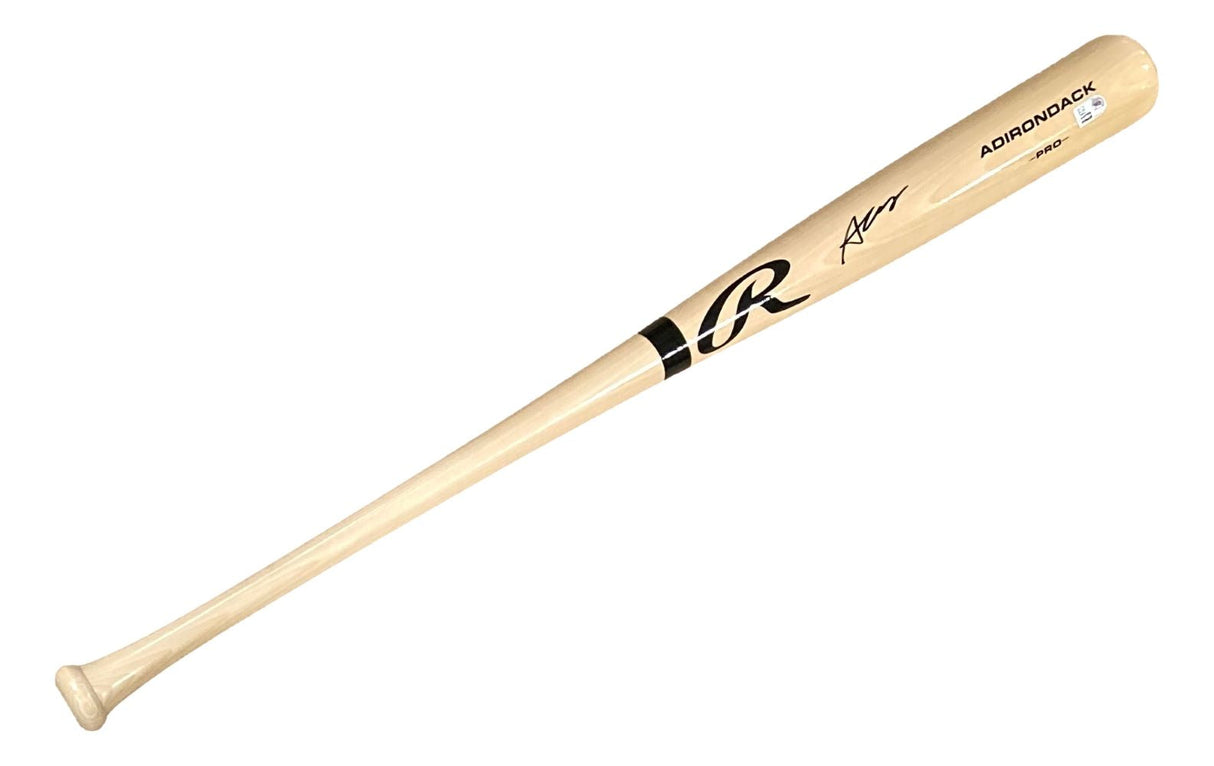 A tan Rawlings Pro baseball bat by Sports Integrity, featuring black lettering, a large R logo, "ADIRONDACK," and Austin Wells' signature. New York Yankees collectible, signed and authenticated by Fanatics.