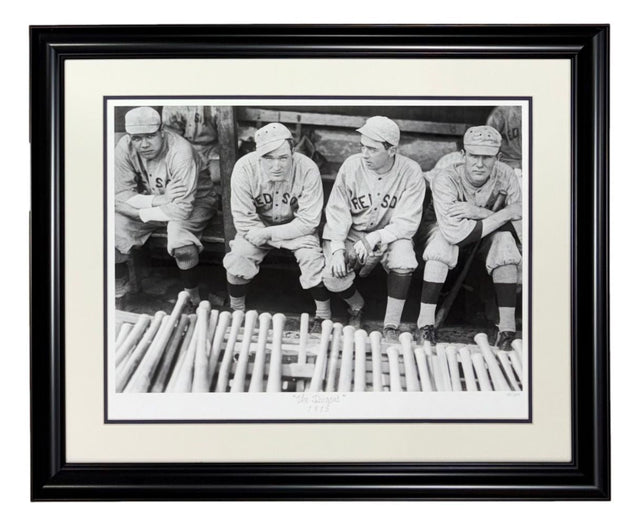 The Sports Integrity Babe Ruth Boston Red Sox Framed The Dugout Historical Archive Giclee features a black and white photo of four vintage baseball players on a bench with bats, framed in black with a white mat.