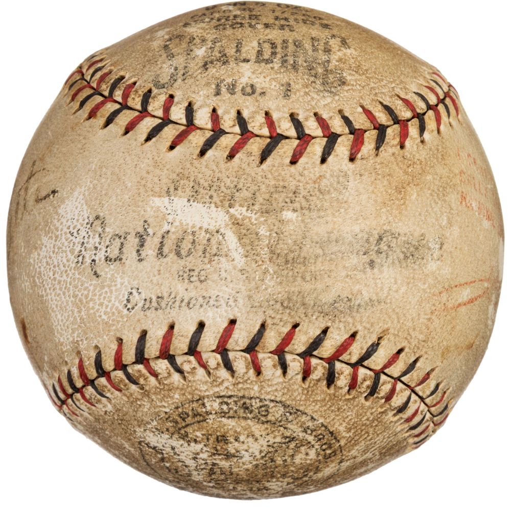 A vintage Spalding baseball with faded black and red stitching, partially visible branding, signed by Babe Ruth and Lou Gehrig, offered by Sports Integrity with PSA+BAS LOA.