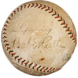 A vintage Spalding baseball by Sports Integrity features visible red stitching, faded handwriting, and signatures of Babe Ruth and Lou Gehrig from the New York Yankees, authenticated with PSA+BAS LOA.
