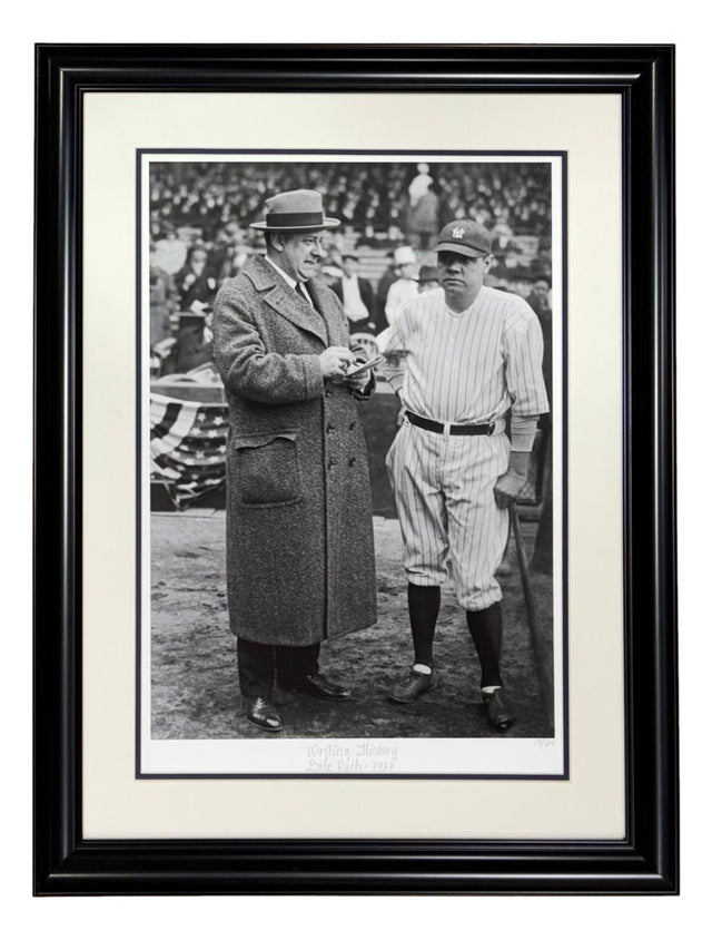 The Sports Integrity "Babe Ruth New York Yankees Framed Writing History Historical Archive Giclee 2" features a black and white photo of two men—one in a coat and one in a pinstripe uniform—at a baseball field with a crowd in the background.