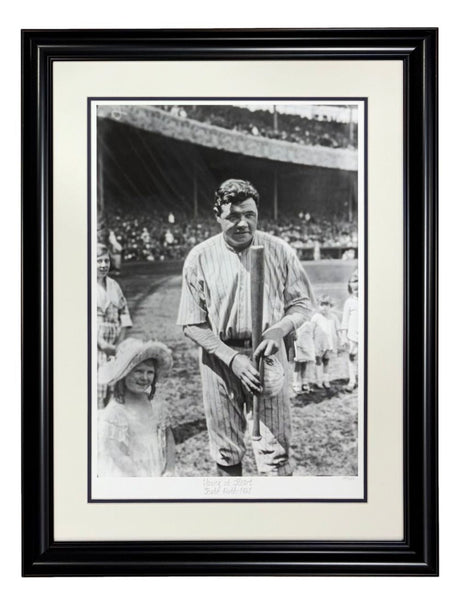 Sports Integrity Babe Ruth New York Yankees Framed Young At Heart Historical Archive Giclee features a black and white photo of Babe Ruth in uniform holding a bat with children nearby and a stadium full of spectators in the background.