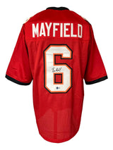 A Baker Mayfield Tampa Bay Signed Red Football Jersey by Sports Integrity featuring "MAYFIELD" and number 6 on the back, with the number autographed in black marker.