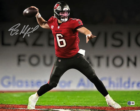 A Baker Mayfield Signed 16x20 Buccaneers Spotlight Red Jersey Photo from Sports Integrity shows him preparing to throw a football, with his autograph visible in the upper left corner.
