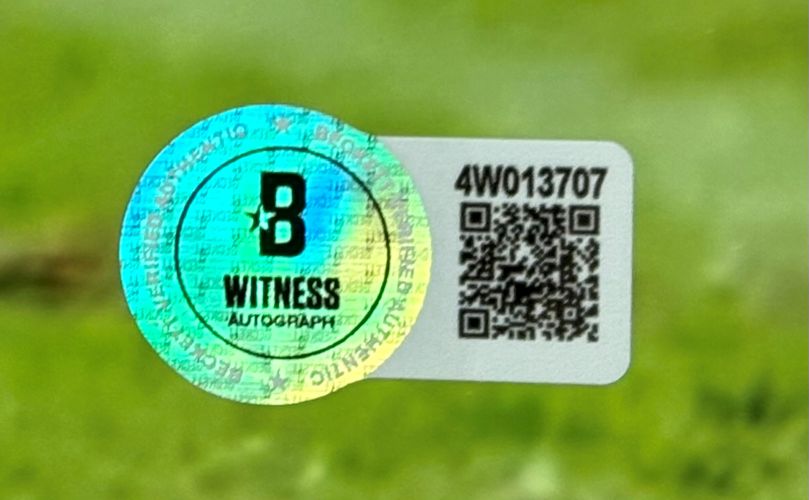 A holographic sticker labeled B WITNESS AUTOGRAPH appears next to a QR code and serial number 4W013707 on the Baker Mayfield Signed Framed 16x20 Buccaneers Spotlight White Jersey Photo by Sports Integrity.