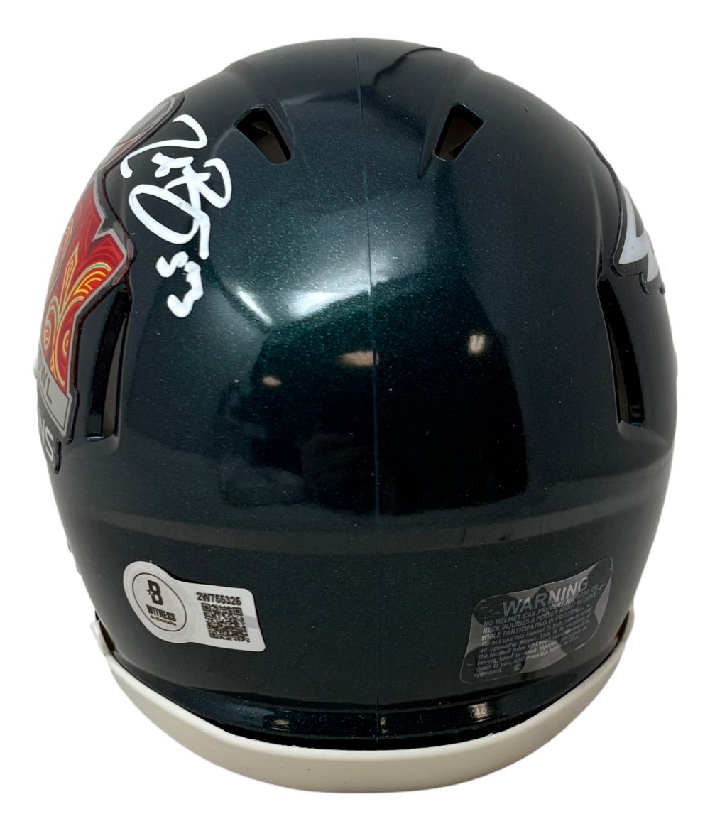 A Zack Baun signed Philadelphia Eagles Super Bowl 59 Mini Speed Helmet by Sports Integrity, dark green with a white autograph (#3), red and gold decal on the left, certification stickers, white lower edge, and includes a BAS case.