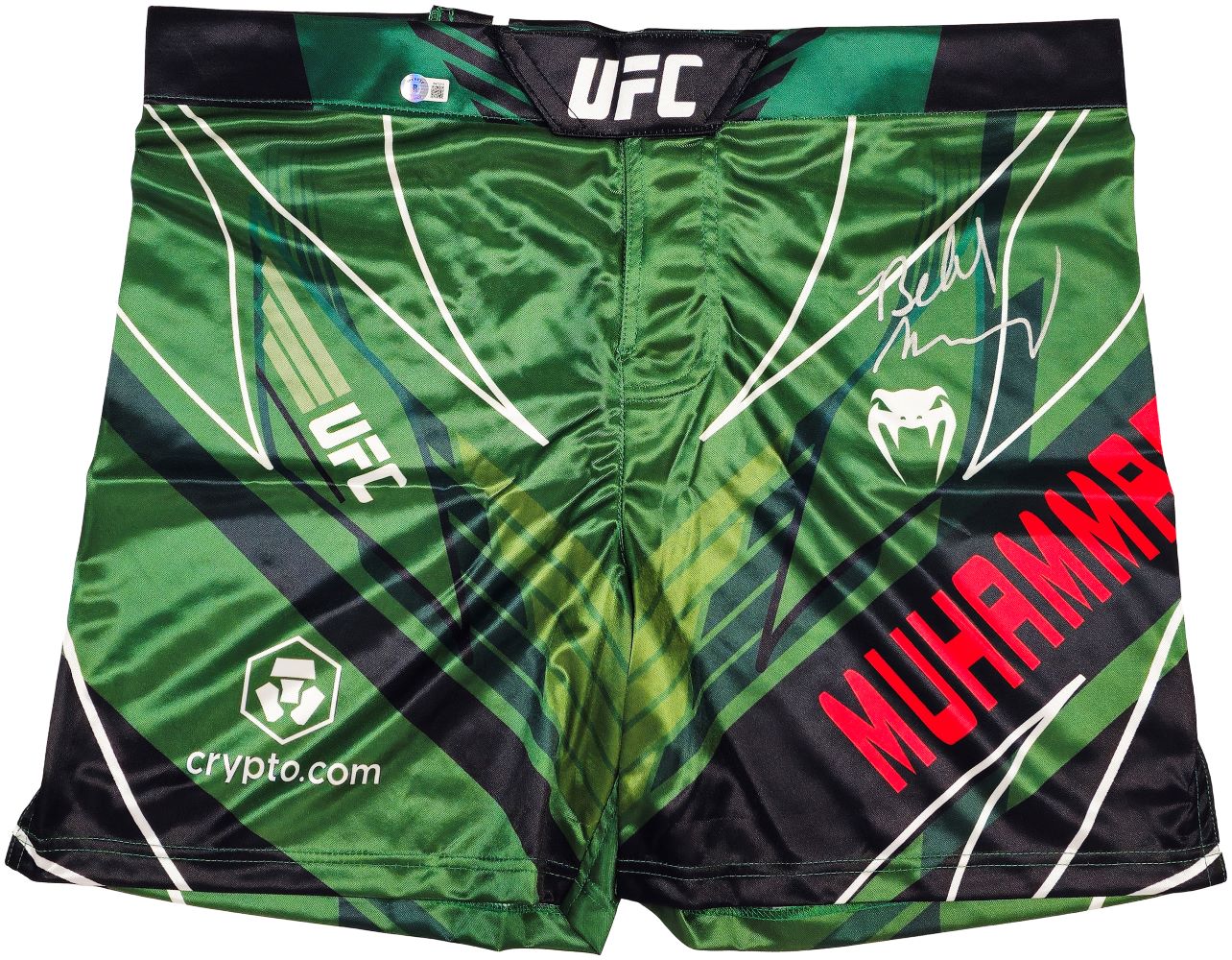Belal Muhammad Signed Custom Green MMA Fight Trunks by Sports Integrity feature geometric patterns, UFC, Venum, and crypto.com logos, MUHAMMAD in red, and an autograph on the right side.