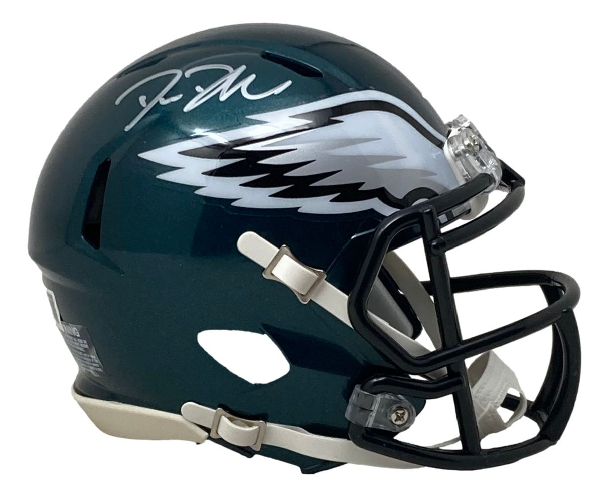 A Sports Integrity Big Dom DiSandro Signed Philadelphia Eagles Mini Speed Helmet (BAS), featuring a dark green shell, white and silver eagle wing logo on the right side, and a white signature on top.
