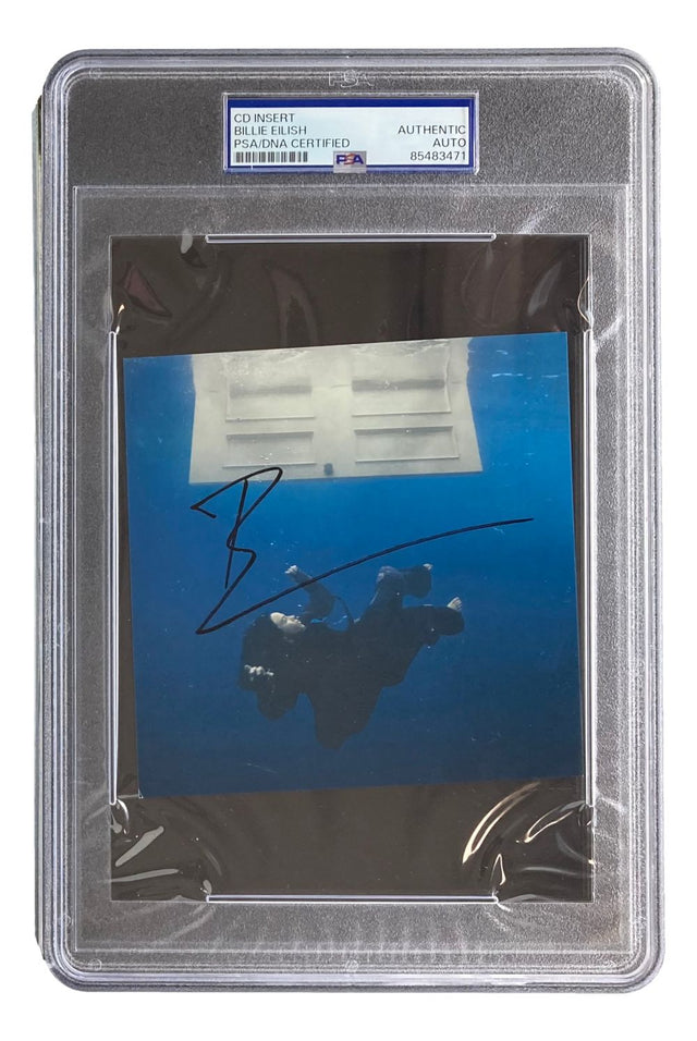 A Billie Eilish Signed Slabbed "Hit Me Hard And Soft" CD Insert by Sports Integrity is presented in a PSA-certified protective case, featuring Billie’s autograph on the cover art.