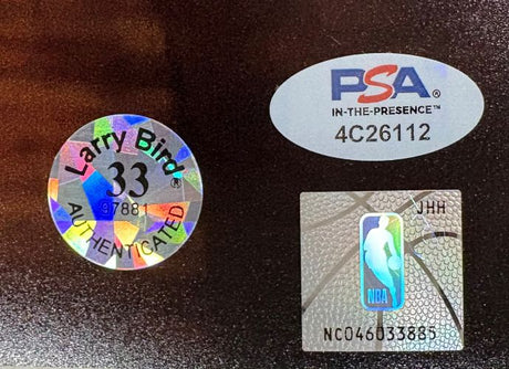 The Larry Bird Signed 16x20 Boston Celtics vs Lakers Photo by Sports Integrity features a holographic Larry Bird 33 AUTHENTICATED sticker, a PSA sticker with code 4C26112, and an NBA silver basketball logo sticker (NC04603388).