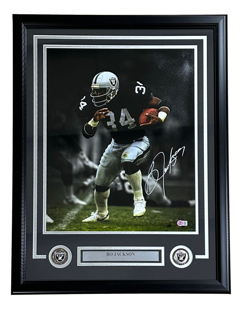 Sports Integrity Bo Jackson Signed Framed 16x20 Oakland Raiders Black Jersey Photo BAS features Bo Jackson in a black and white #34 uniform, running with the ball, with two Raiders logos and a nameplate in the frame.