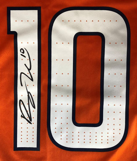 The Bo Nix Signed Denver Broncos Orange Nike Game Replica Jersey by Sports Integrity features a large white number 10 outlined in navy, with Bo Nix's autograph in black marker on the left side of the 1.