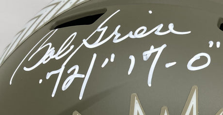 Close-up of a Bob Griese signed Dolphins FS Salute To Service Speed Replica Helmet (Sports Integrity), matte olive green, with his signature and "72 17-0" inscribed.