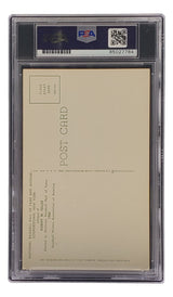 A graded and encapsulated Bob Feller Signed 4x6 Cleveland Hall Of Fame Plaque Card by Sports Integrity is shown from the back, with PSA/DNA label, barcode, and cert number 85027784 visible at the top of the clear plastic case.