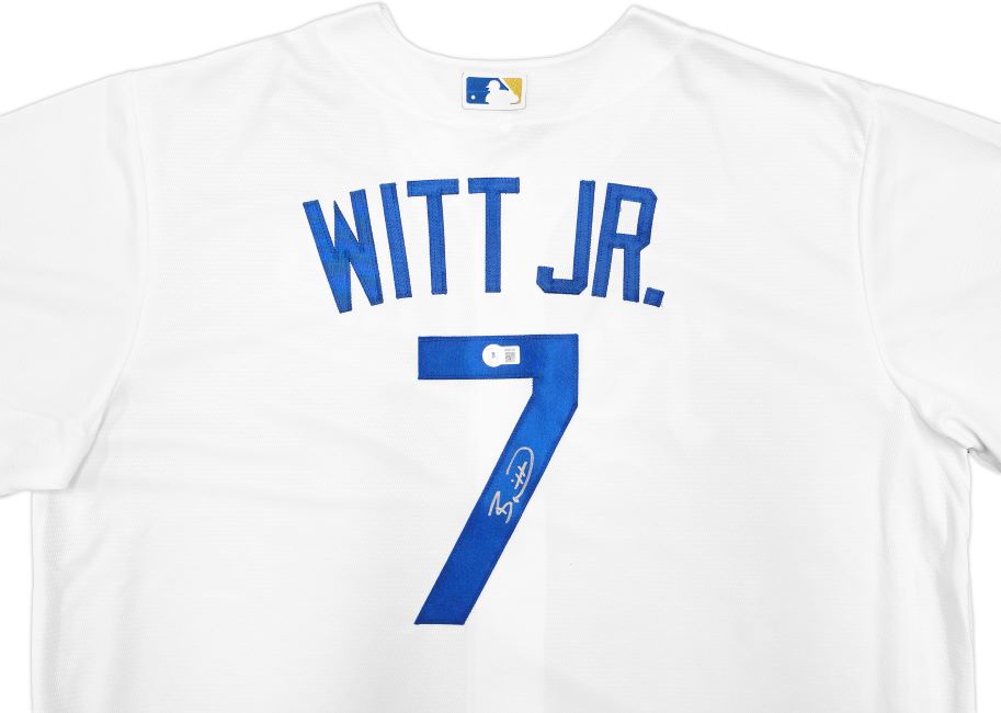 The Sports Integrity Bobby Witt Jr Signed Kansas City Royals White Nike Replica Jersey features blue "WITT JR." lettering, the number 7 with his white autograph and authentication sticker, plus an MLB logo on the collar.