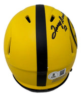 The Sports Integrity Terry Bradshaw Signed Pittsburgh Steelers Rave Mini Speed Helmet BAS features a yellow shell with a black stripe, multiple air vents, a black autograph on one side, and an authentication QR code sticker near the bottom.