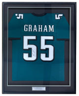 The Sports Integrity Brandon Graham SB 59 Champ Philadelphia green football jersey, signed and framed with "GRAHAM" and number 55, features a small centered plaque below the jersey inside the display. Authenticated by JSA.