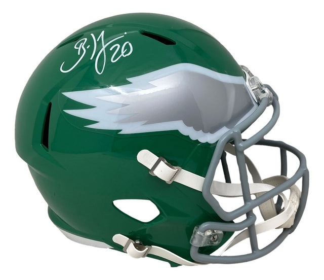 A Brian Dawkins Signed Philadelphia Eagles FS Kelly Green Speed Replica Helmet by Sports Integrity, featuring a silver wing design and white facemask, with "B.J. 20" autographed on top.