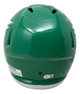 A Brian Dawkins Signed Philadelphia Eagles FS Kelly Green Speed Replica Helmet by Sports Integrity, viewed from the back with air vents, a white warning label, and a small round sticker near the base.