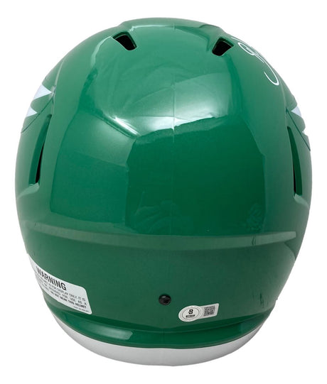 A Brian Dawkins Signed Philadelphia Eagles FS Kelly Green Speed Replica Helmet by Sports Integrity, viewed from the back with air vents, a white warning label, and a small round sticker near the base.