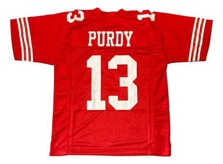 The Sports Integrity Brock Purdy San Francisco Red Football Jersey features white sleeve stripes, "Purdy" and the number 13 in bold white print on the back.