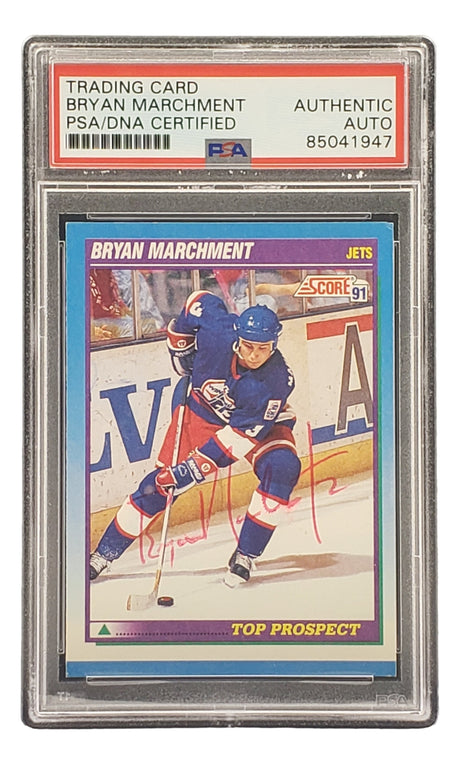 The Sports Integrity Bryan Marchment Signed 1991 Score #344 Winnipeg Jets card is PSA/DNA certified, features a Top Prospect label, and comes in a protective holder.