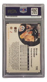 The Sports Integrity Bryan Trottier Signed 1991 Pro Set #192 Pittsburgh Penguins Hockey Card PSA/DNA features Trottier’s stats, career info, and his photo wearing a helmet on the card back.