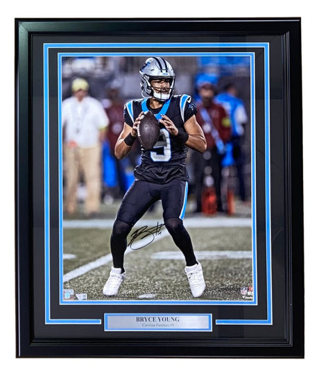 This Sports Integrity Bryce Young Signed Framed 16x20 Carolina Panthers photo shows him in a black uniform preparing to throw, with a silver nameplate displaying "BRYCE YOUNG Carolina Panthers #9.