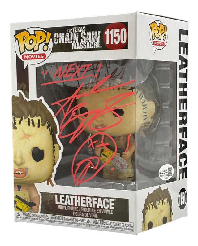 A Sports Integrity Funko Pop #1150 from Texas Chainsaw Massacre, signed by Andrew Bryniarski in red with "Next!" on the window, JSA authenticated.