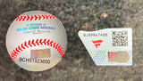 A close-up of two authentication stickers for a Cal Ripken Jr Signed Framed 16x20 Orioles Game 2131 Photo by Sports Integrity: one baseball-shaped with MLB text, hologram, and code BCH91923600; the other rectangular with QR code RJ89847488 and red logo.