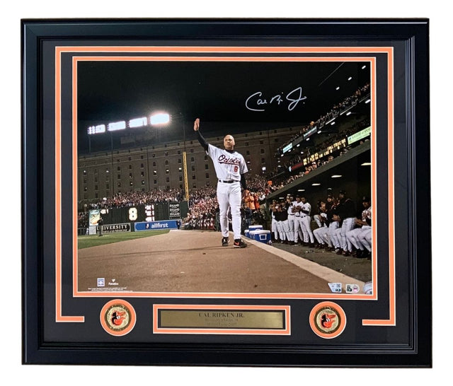 Sports Integrity Cal Ripken Jr Signed Framed 16x20 Baltimore Orioles Final Game Photo features Ripken waving to fans, teammates watching, his signature at the top, and a plaque below reading CAL RIPKEN JR. flanked by Orioles logos.