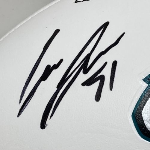 Close-up of Cam Jurgens’ black signature on a white Eagles logo football by Sports Integrity, featuring teal and black patterning at the edge. Includes PSA/DNA authentication and Super Bowl 59 LIX case.