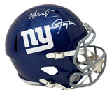 A blue New York Giants FS Replica Speed Helmet by Sports Integrity, featuring white "ny" logo, gray facemask, and autographs from Lawrence Taylor and Abdul Carter. BAS authenticated.