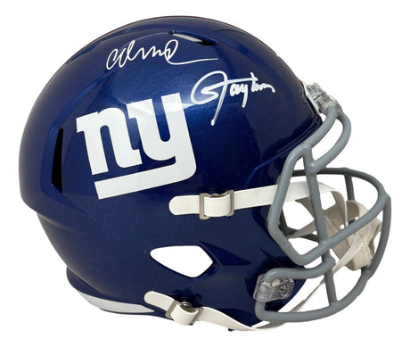 A blue New York Giants FS Replica Speed Helmet by Sports Integrity, featuring white "ny" logo, gray facemask, and autographs from Lawrence Taylor and Abdul Carter. BAS authenticated.