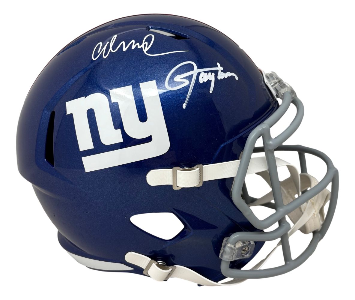 A blue New York Giants FS Replica Speed Helmet by Sports Integrity, featuring white "ny" logo, gray facemask, and autographs from Lawrence Taylor and Abdul Carter. BAS authenticated.