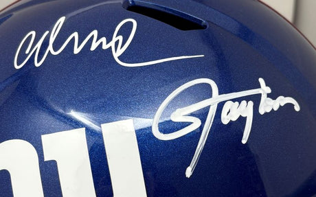 A close-up of the Sports Integrity Lawrence Taylor Abdul Carter Signed New York Giants FS Replica Speed Helmet, showcasing two white autographs and part of a white number on the left side.