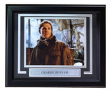 The Sports Integrity Charlie Hunnam Signed Framed 8x10 Pacific Rim Photo (JSA) features an autograph and a nameplate, showing Hunnam in outdoor gear in front of an industrial background, looking to the side.