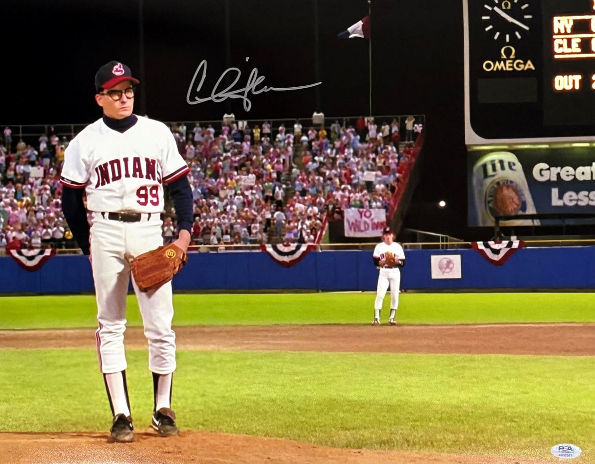 The Charlie Sheen Signed 16x20 Major League Ricky Vaughn Photo by Sports Integrity shows Sheen in a white Indians #99 uniform on the mound, with fans and a scoreboard in the background. Includes PSA/DNA hologram.