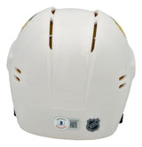 A Chevy Chase signed Chicago Blackhawks mini helmet by Sports Integrity, shown from the back with BAS authentication and NHL logo stickers near the bottom, features ventilation slits and a smooth, glossy white finish.
