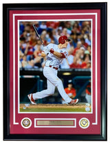 A Chase Utley Signed Framed 16x20 Philadelphia Phillies Photo by Sports Integrity, featuring Utley in a white pinstripe uniform swinging a bat, with two commemorative patches and a nameplate included at the bottom of the frame.