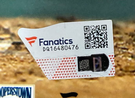 Close-up of a Sports Integrity Fanatics authentication sticker with QR code, serial DQ16480476, and holographic feature on the "Chase Utley Signed Framed 16x20 Philadelphia Phillies Photo.