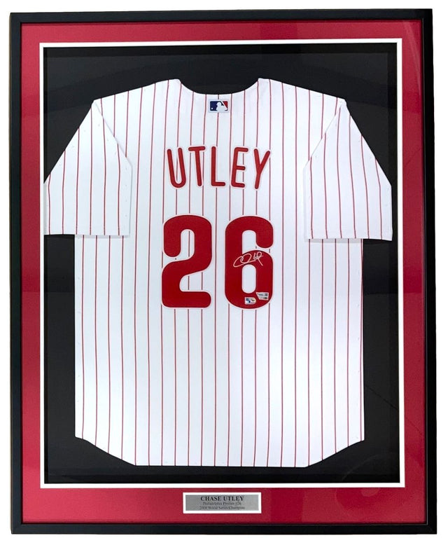 The Sports Integrity Chase Utley Signed Framed Philadelphia Phillies Nike Limited Jersey features UTLEY and 26 in red, an autograph on the number, red pinstripes, a white background, a black/red border, and a nameplate.