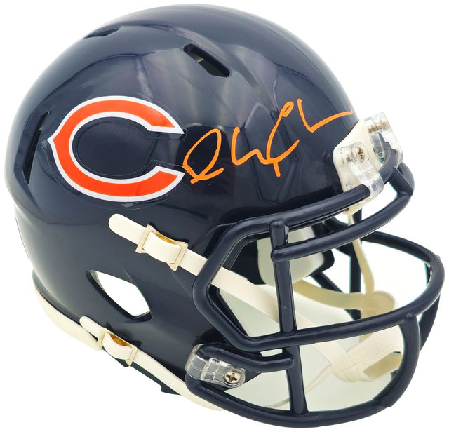 The Sports Integrity Chevy Chase Signed Chicago Bears Mini Speed Helmet BAS features a dark blue helmet with the team's orange "C" logo and Chevy Chase's orange signature on top.