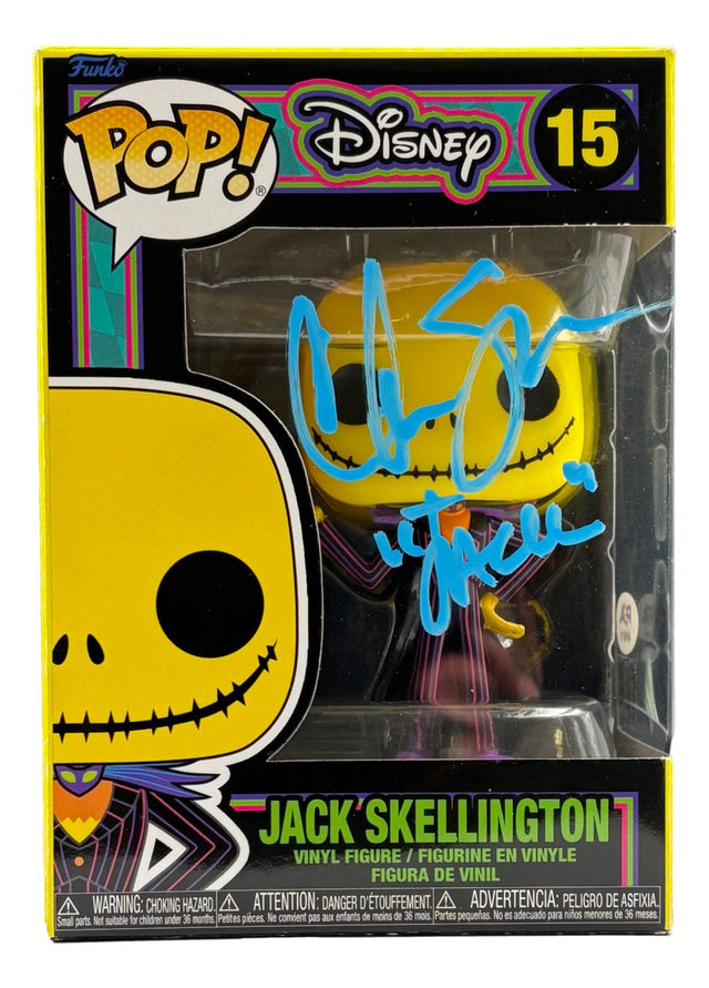 Chris Sarandon Signed A Nightmare Before Christmas Funko Pop #15 by Sports Integrity, PSA/DNA Holo certified, in box with a large yellow skull face and blue autograph on the clear window.