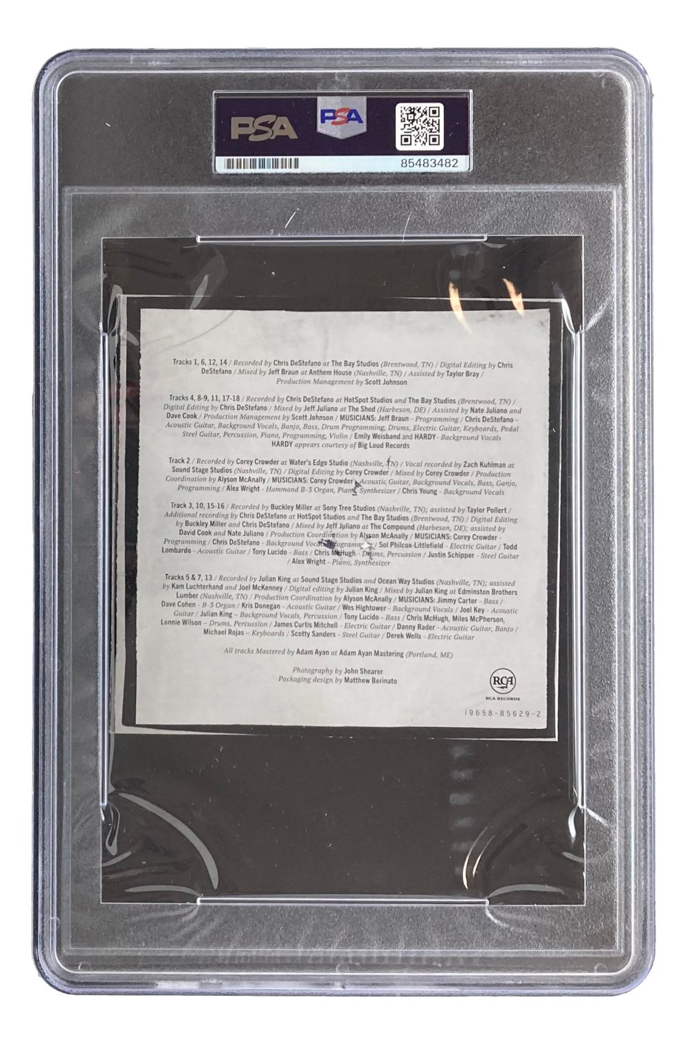 The Chris Young Signed Slabbed Young Love & Saturday Nights CD Booklet by Sports Integrity features PSA authentication, a white label at the top, and music tracks and credits visible inside the clear plastic case.